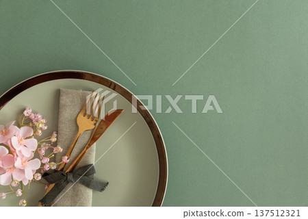 Elegant Table Setting with Napkin and Gold Cutlery. Stylish Easter Spring Arrangement 137512321