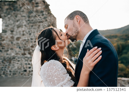 Portrait of husband kissing beautiful bride. 137512341