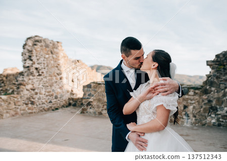 Portrait of husband kissing beautiful bride. 137512343