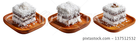 Chocolate-coated sponge lamington sponge cake covered in shredded coconut isolated on white background 137512532