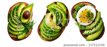 California avocado toast topped with ripe avocado slices, boiled egg, sesame seeds, herbs and sauce, isolated on white background 137512549
