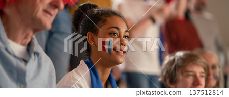 Excited football fans supproting French national team in live soccer match at stadium. Excited football fans supproting French national team in live soccer match at stadium. 137512814