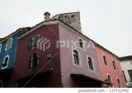 Colorful historic buildings in Mostar old town with stone walls and shuttered windows. Traditional Balkan architecture reflecting cultural heritage and urban character 137512992