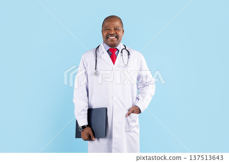 Mature black doctor wearing medical coat and stethoscope standing on blue background Mature black doctor wearing medical coat and stethoscope standing on blue background 137513643