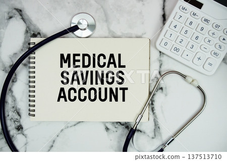 Medical Savings Account (MSA) text written on notepad with stethoscope and  calculator on marble background 137513710