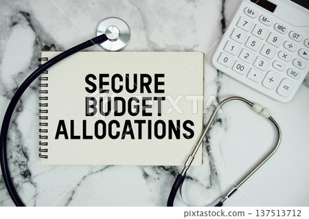 Secure Budget Allocations text written on notepad with stethoscope and calculator on marble background Secure Budget Allocations text written on notepad with stethoscope and calculator on marble background 137513712