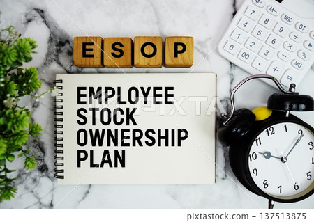 ESOP Employee Stock Ownership Plan text with calculator and alarm clock on marble background ESOP Employee Stock Ownership Plan text with calculator and alarm clock on marble background 137513875