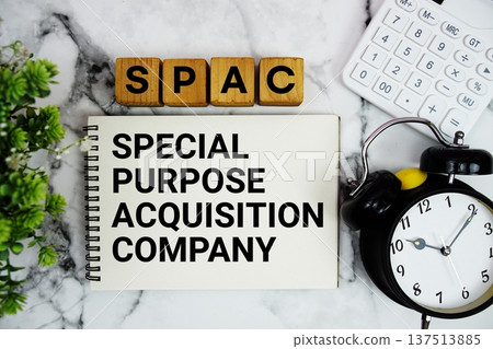 SPAC Special Purpose Acquisition Company text with calculator and alarm clock on marble background 137513885