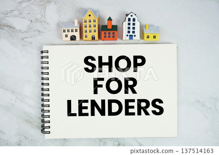 Shop For Lenders text written on notepad with house model on marble background 137514163