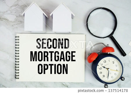 Second Mortgage Option text written on notepad with house model, magnifying glass and alarm clock on marble background Second Mortgage Option text written on notepad with house model, magnifying glass and alarm clock on marble background 137514178