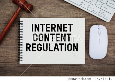 Internet Content Regulation text written with gavel, keyboard and optical mouse on wooden background Internet Content Regulation text written with gavel, keyboard and optical mouse on wooden background 137514219