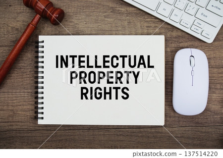 Intellectual Property Rights text written with gavel, keyboard and optical mouse on wooden background 137514220