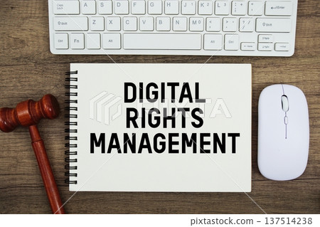 Digital Rights Management text written with gavel, keyboard and optical mouse on wooden background Digital Rights Management text written with gavel, keyboard and optical mouse on wooden background 137514238