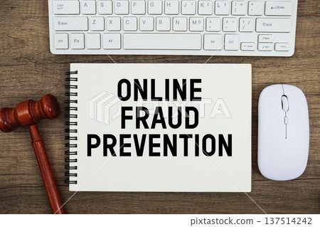 Online Fraud Prevention text written with gavel, keyboard and optical mouse on wooden background Online Fraud Prevention text written with gavel, keyboard and optical mouse on wooden background 137514242