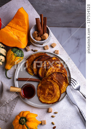 Pumpkin pancakes with maple syrup Pumpkin pancakes with maple syrup 137514528