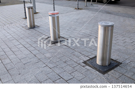 Automatic retractable bollards on a sidewalk in Berlin Automatic retractable bollards on a sidewalk in Berlin 137514654