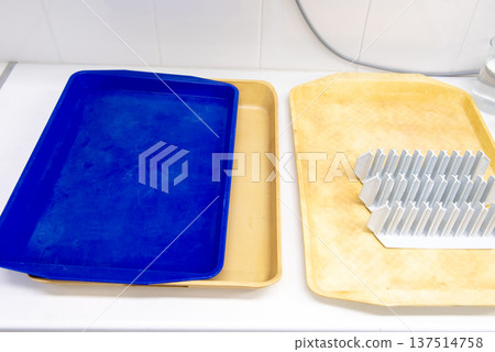 laboratory equipment. plastic tube racks on a yellow plastic tray. 137514758