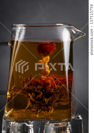 Hot tea in a cup on an old background. Hot tea in a cup on an old background. 137515759