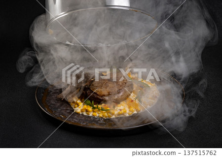 Duck leg with risotto, pumpkin and herbs on a dark background Duck leg with risotto, pumpkin and herbs on a dark background 137515762