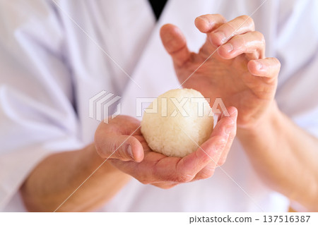 A chef making rice balls A chef making rice balls 137516387