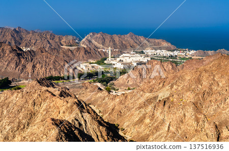Scenic elevated view of the Council of Oman in Al Bustan area nestled between the rugged arid mountains and the Arabian Sea in Muscat 137516936