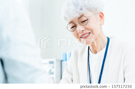 Senior woman receiving consultation Senior woman receiving consultation 137517250