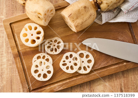 Cut lotus root prepared on a cutting board 137518399