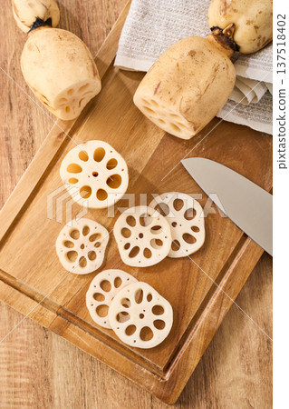 Cut lotus root prepared on a cutting board Cut lotus root prepared on a cutting board 137518402