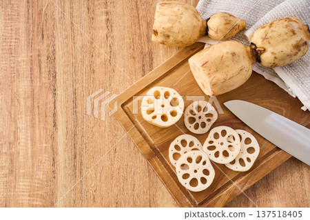 Cut lotus root prepared on a cutting board 137518405