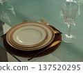 table set on white plates in restaurant 137520295