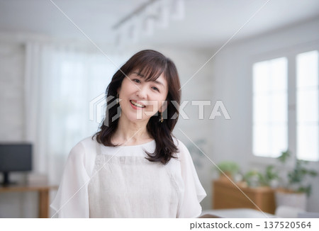A lovely middle-aged woman with a smile A lovely middle-aged woman with a smile 137520564