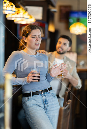 Man tries unsuccessfully to flirt with woman 137520976