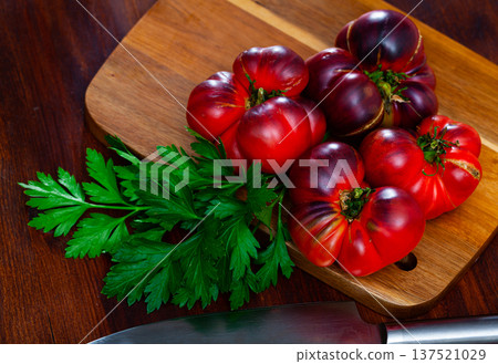 Brown tomatoes on wooden desk in home kitchen Brown tomatoes on wooden desk in home kitchen 137521029