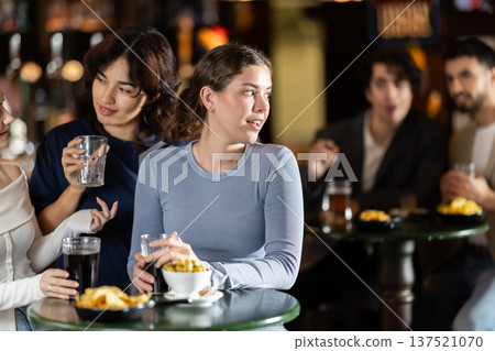 Girls spend time at bar. 137521070