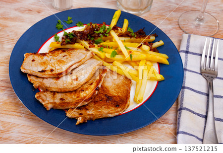 Appetizing fried pork with potatoes and herbs Appetizing fried pork with potatoes and herbs 137521215