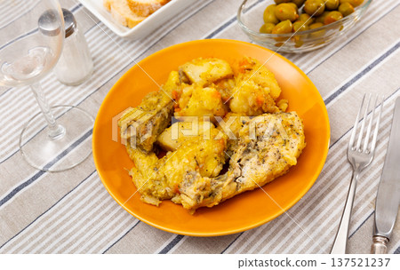 Chicken drumsticks with boiled potatoes with sauce Chicken drumsticks with boiled potatoes with sauce 137521237