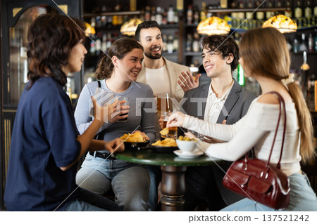 Group of friends happily having time at bar 137521242