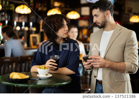 man asks a woman for a number 137521386
