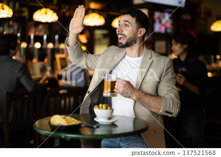Man sitting in bar and watching game Man sitting in bar and watching game 137521568