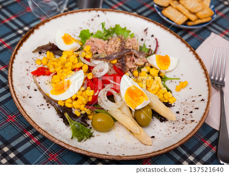 Salad with cod anchovies and sauce from catalonia Salad with cod anchovies and sauce from catalonia 137521640