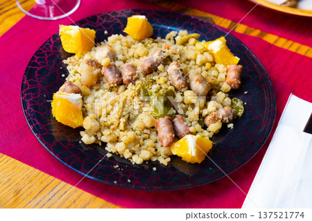 Typical spanish dish from semolina flour with longaliza sausage 137521774