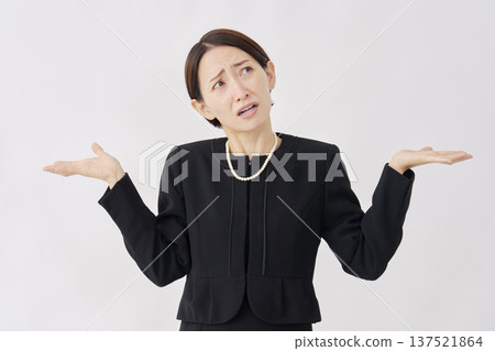 Woman in mourning clothes giving up gesture on white background Woman in mourning clothes giving up gesture on white background 137521864
