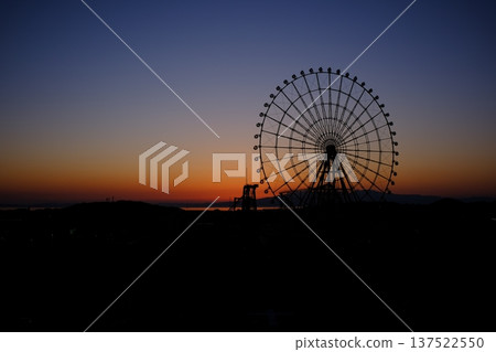 Ferris wheel shining in the sunset Ferris wheel shining in the sunset 137522550
