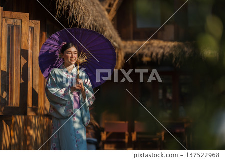 woman in yukata (kimono dress) holding umbrella 137522968
