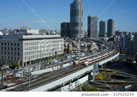 Tobu Limited Express train and skyscrapers seen from Solamachi March Tobu Limited Express train running through Sumida 202 Oshiage 137523254
