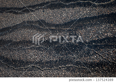 Cracked Asphalt Texture Background Showing Weathered Road Surface Detail Cracked Asphalt Texture Background Showing Weathered Road Surface Detail 137524169