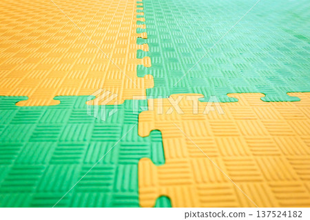 Interlocking EVA Foam Floor Mats Form Modular Surface Pattern Interlocking EVA Foam Floor Mats Form Modular Surface Pattern 137524182