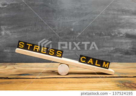 Wooden Seesaw Showing STRESS And CALM Balance Concept Wooden Seesaw Showing STRESS And CALM Balance Concept 137524195