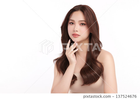 A beautiful young Asian woman with clean, fresh skin against a white background. Skincare, facial treatment, cosmetology, beauty, and spa. An elegant portrait of an Asian woman. A beautiful young Asian woman with clean, fresh skin against a white background. Skincare, facial treatment, cosmetology, beauty, and spa. An elegant portrait of an Asian woman. 137524676