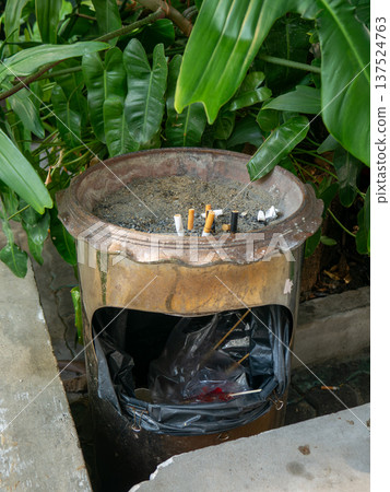 Used Cigarette Butts in Ashtray with Sand Smoking and Health Concept Used Cigarette Butts in Ashtray with Sand Smoking and Health Concept 137524763
